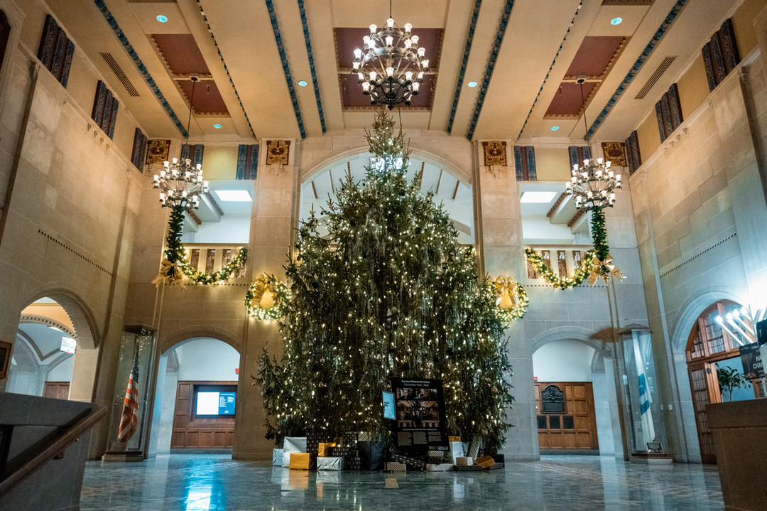 Image of the PMU Great Hall with holiday decorations, Christmas Tree and menorah during the 2024 holiday season.